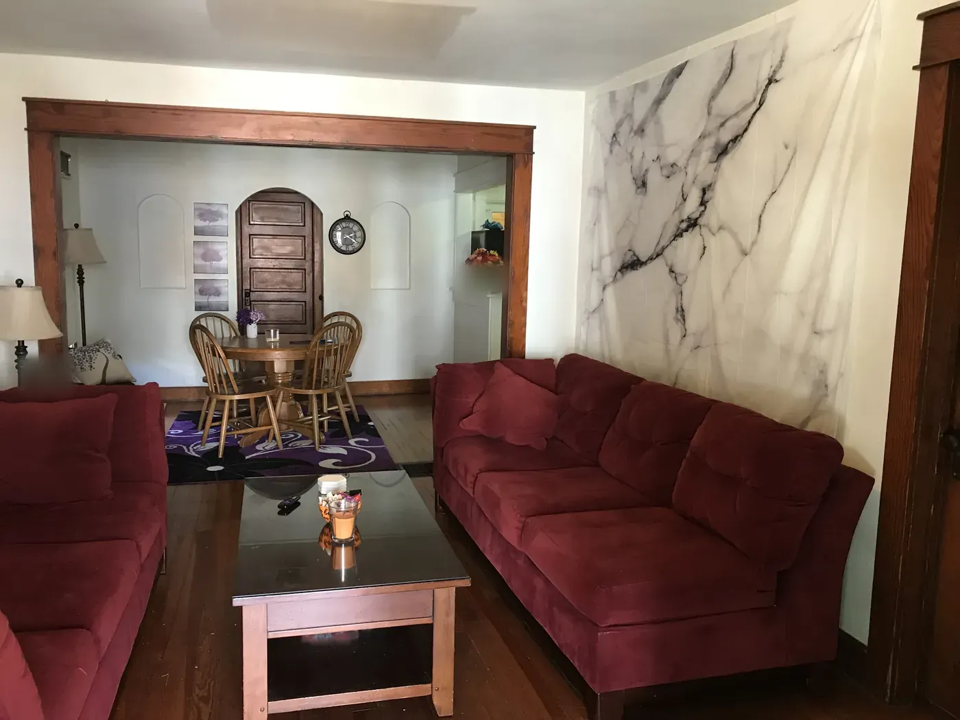 Living room with hardwood floors opening to the dining room